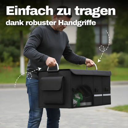 Kofferraum-Organizer mit stabilen Tragegriffen wird voll beladen aus dem Kofferraum herausgehoben

