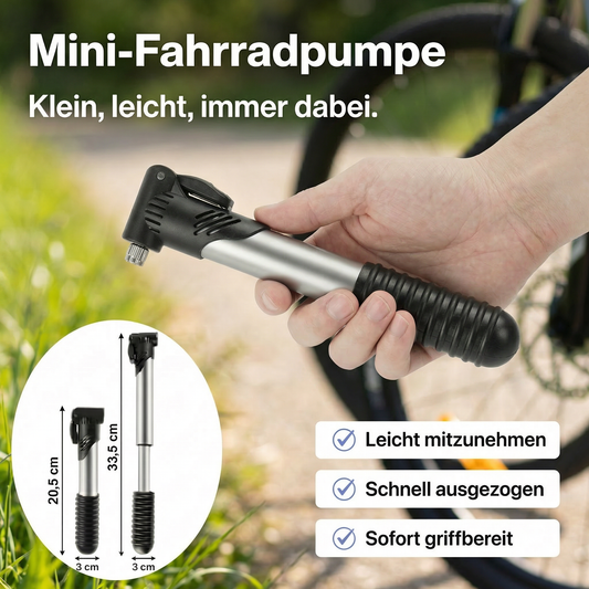Mini-Fahrradpumpe in einer Hand vor unscharfem Fahrrad-Hintergrund, inklusive Detailansicht mit Maßangaben zur Länge.